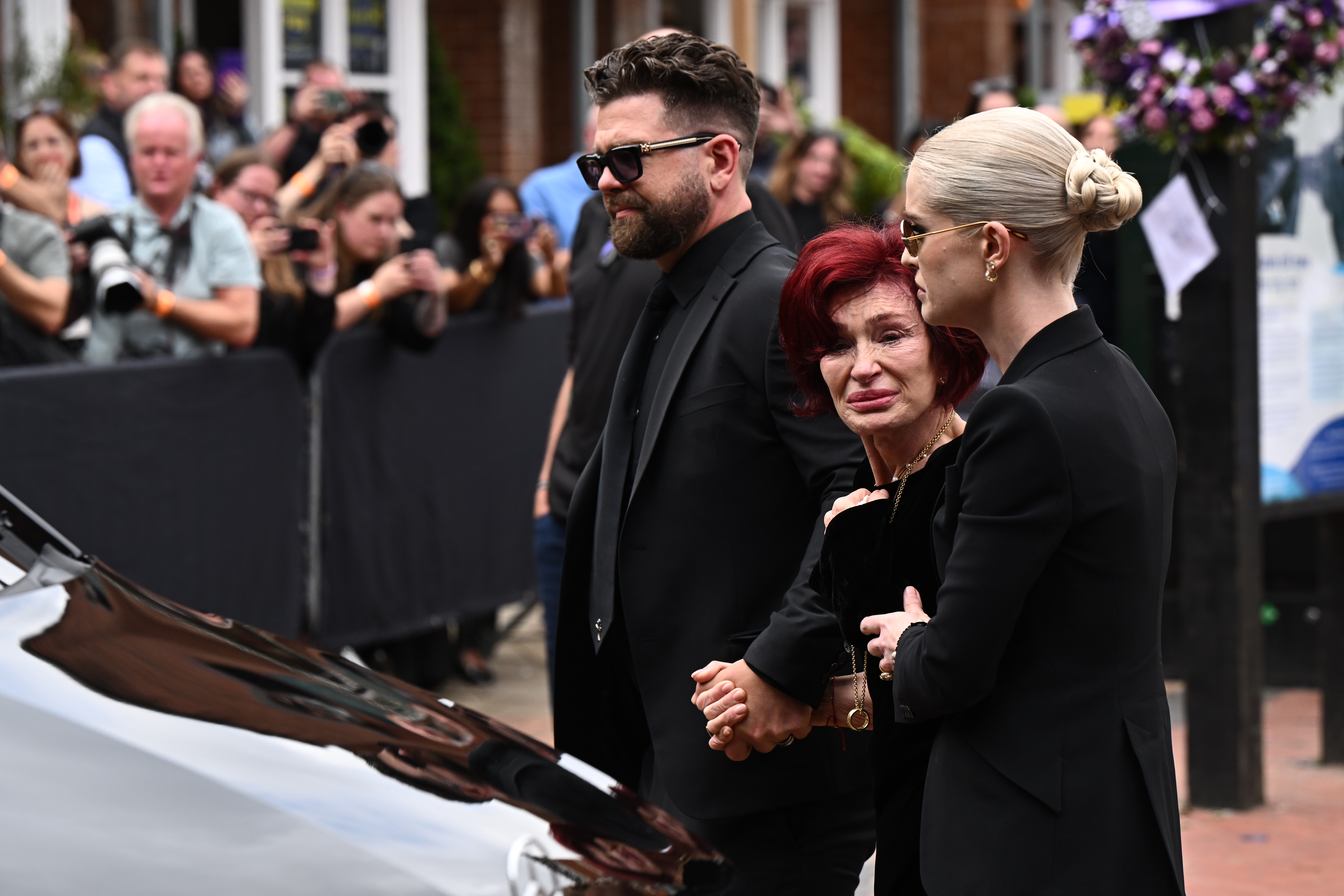 Jack Osbourne, Sharon Osbourne and Kelly Osbourne view tributes to the late Ozzy Osbourne from fans