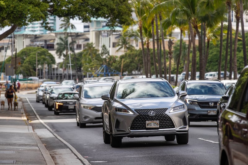 Vehicles depart Waikiki beach in Oahu, Hawaii.