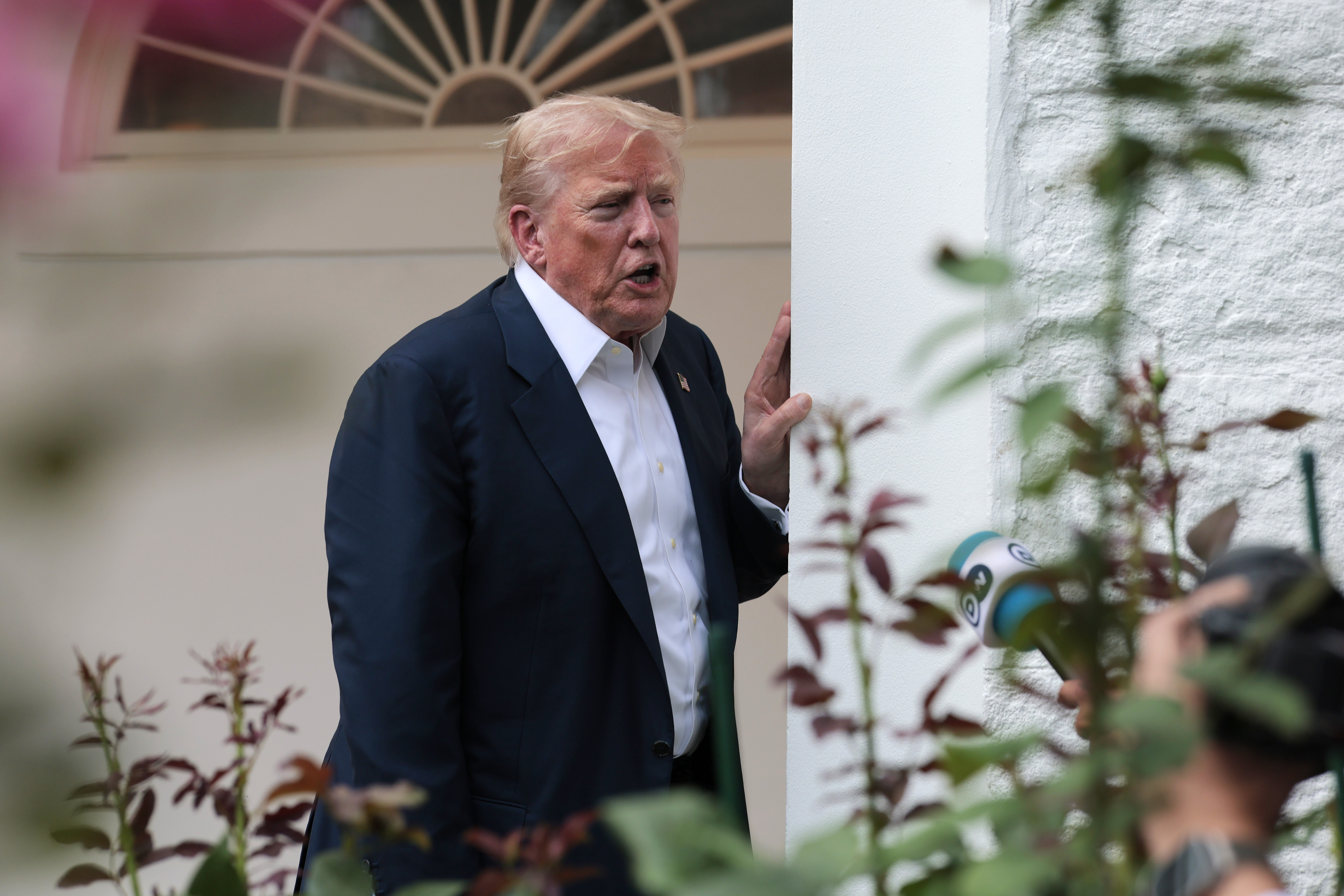 Donald Trump speaking to reporters