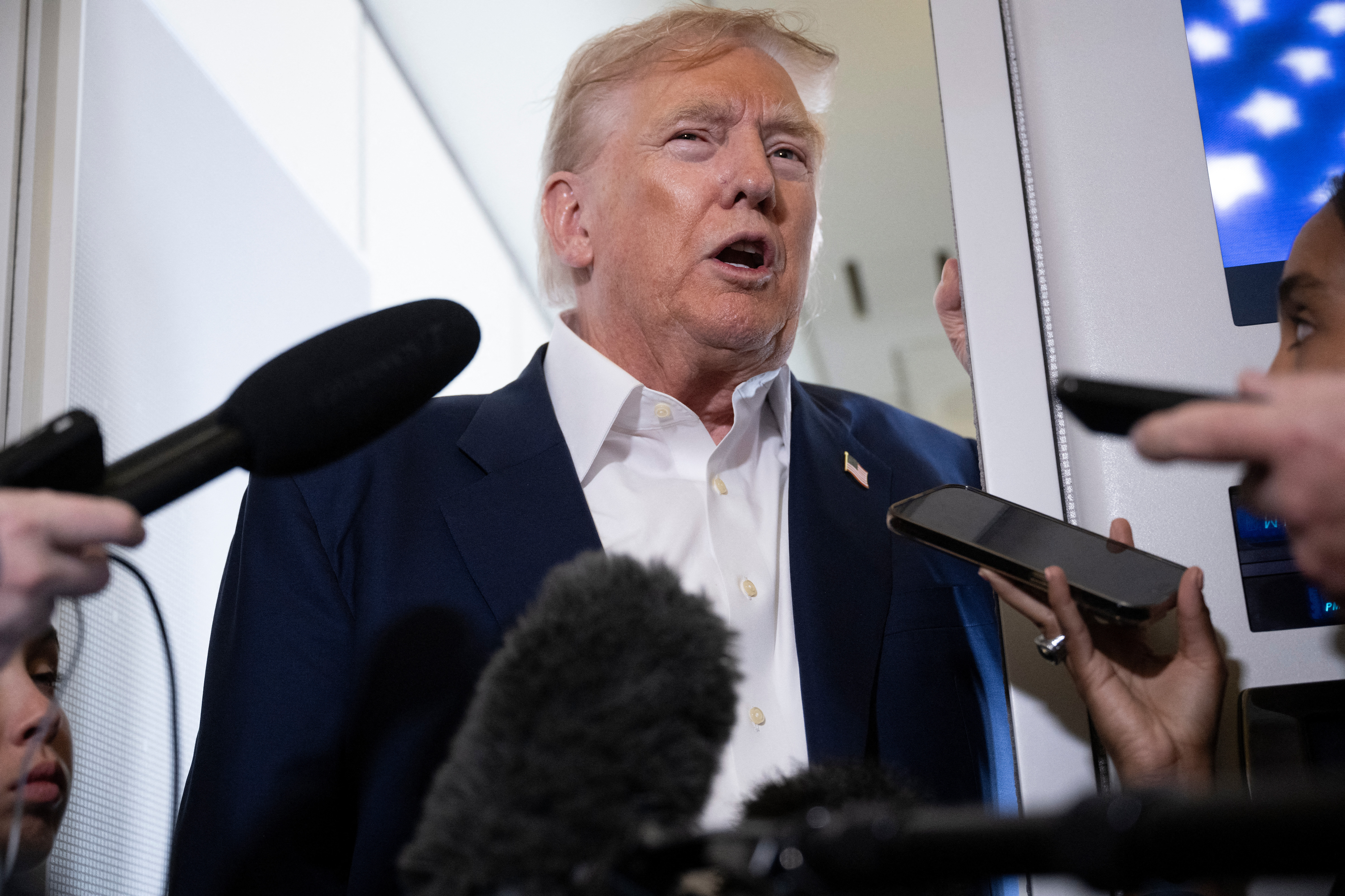Donald Trump speaking to reporters 
