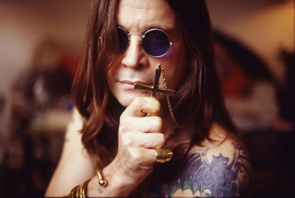 Ozzy Osbourne with a cross pendant necklace