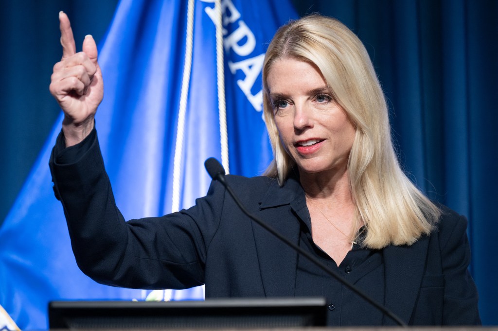 Pam Bondi speaking at a news conference.