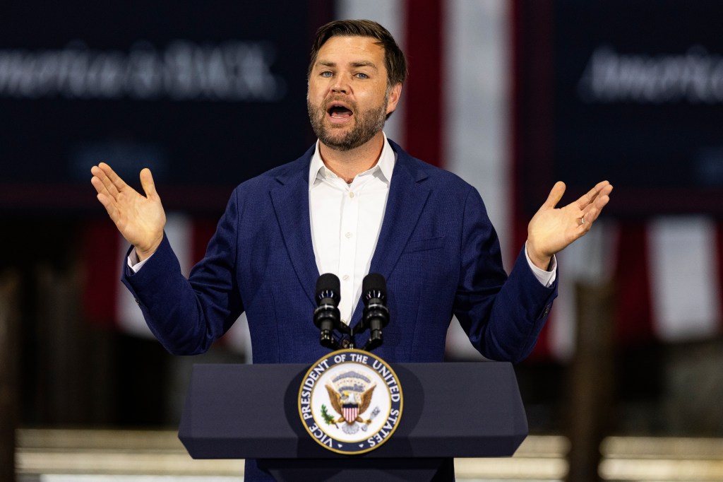 Vice President JD Vance speaking at a podium.