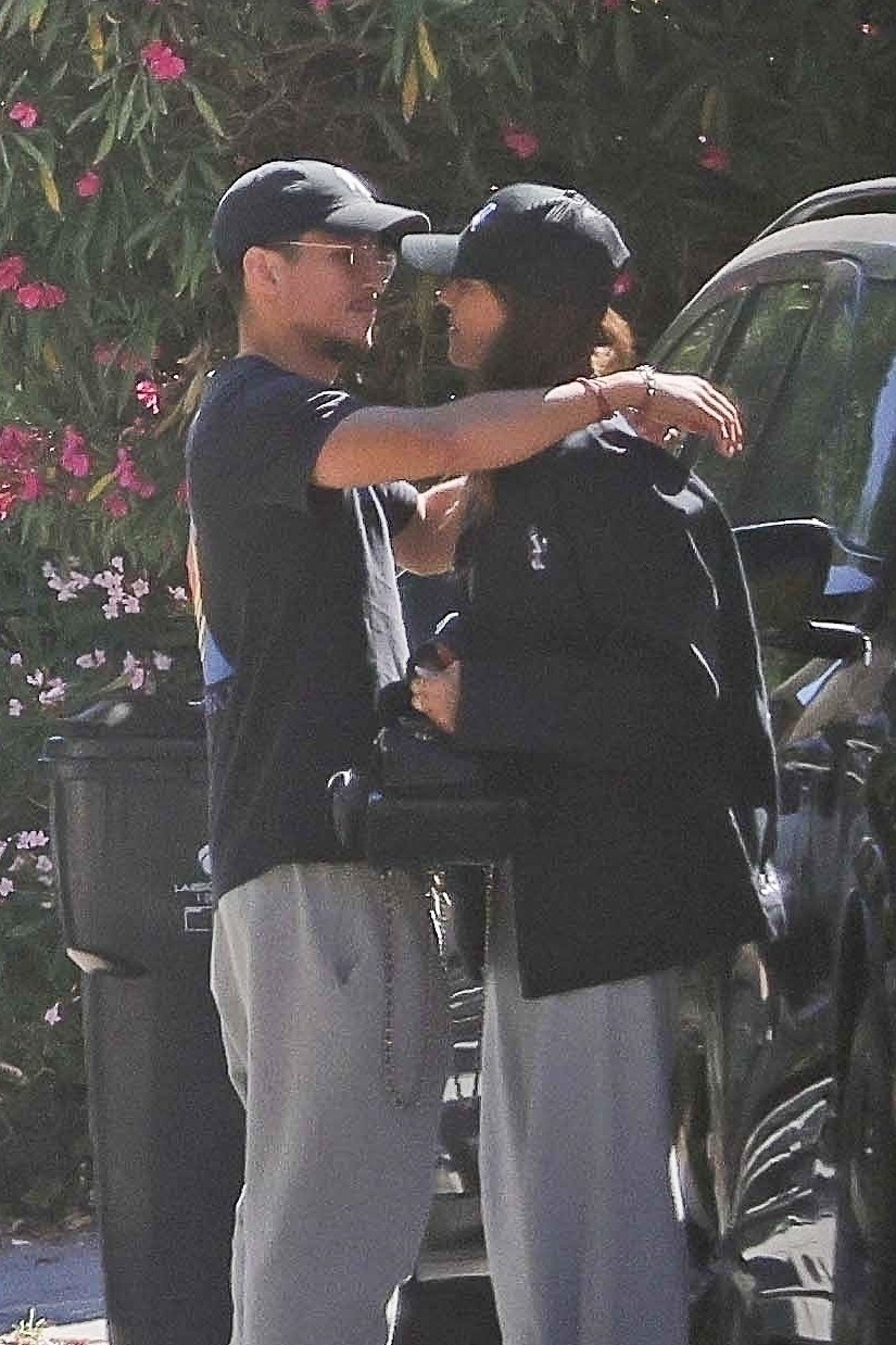Jessica Alba and Danny Ramirez hug outdoors. 