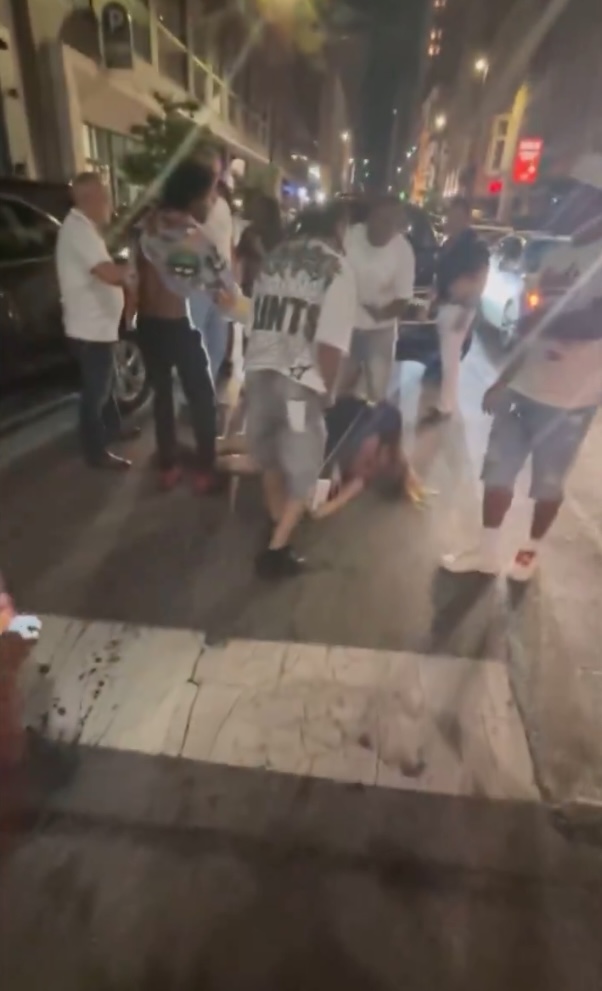 A crowd forms in downtown Cincinnati during the nighttime brawl.
