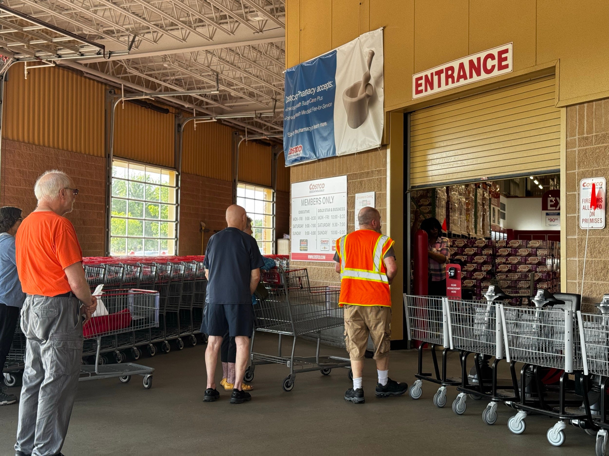 Costco shoppers wait to enter a warehouse in Wisconsin.