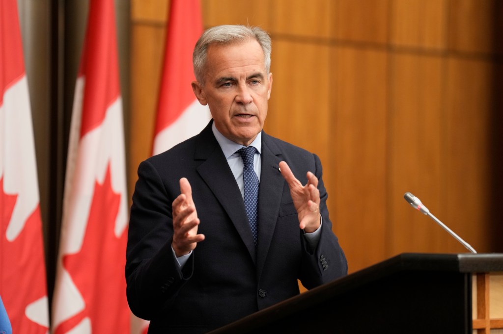Canada Prime Minister Mark Carney speaks with media during a news conference in Ottawa, Ontario, Wednesday, July 30, 2025.
