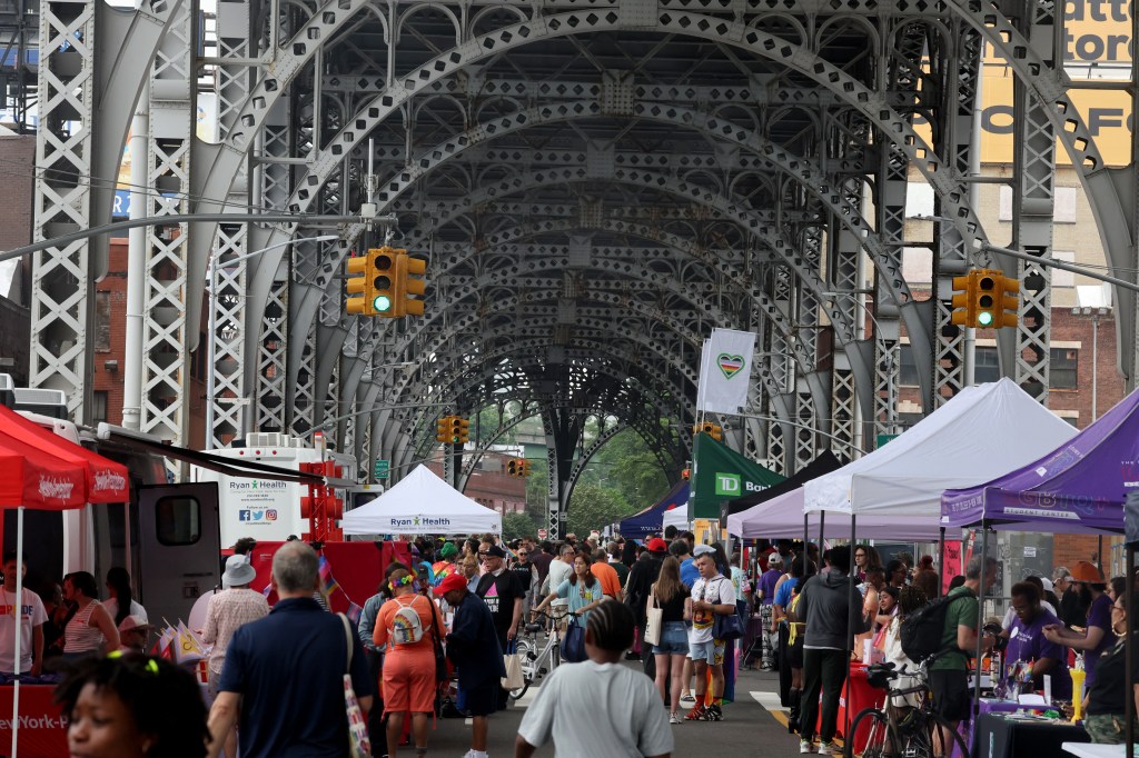 Harlem Pride celebration under a bridge.