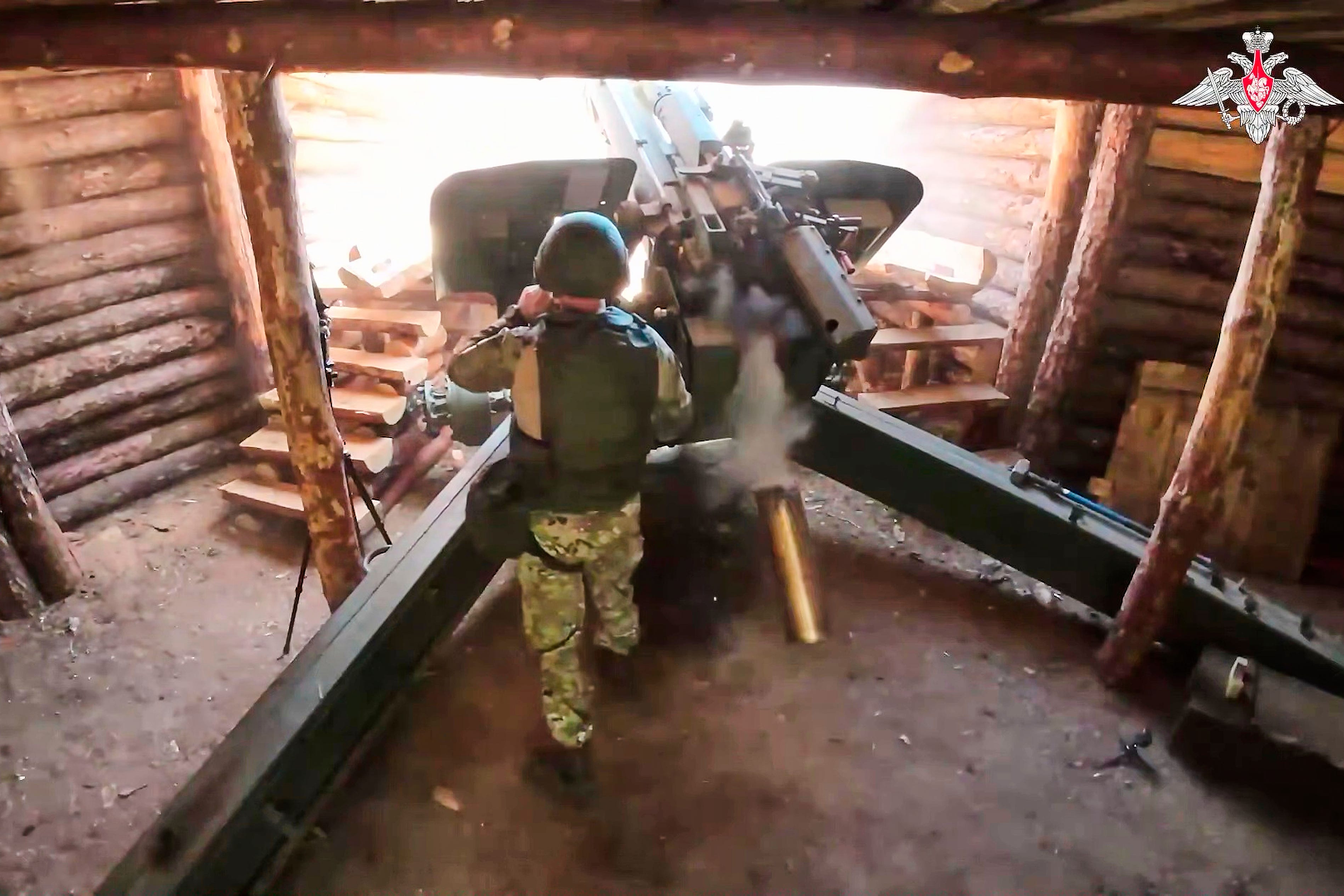 In this photo taken from video distributed by Russian Defense Ministry Press Service on Wednesday, July 16, 2025, a Russian soldier fires a 152 mm howitzer 2A65 Msta-B towards Ukrainian position in an undisclosed location in Ukraine.