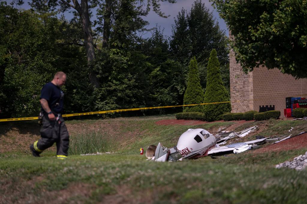 Emergency personnel at the scene of a fatal small plane crash.