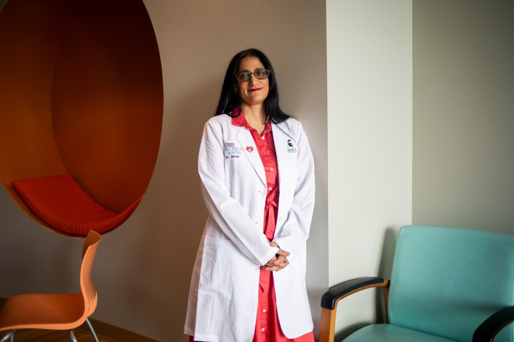 Portrait of Dr. Mona Hanna in a white coat.