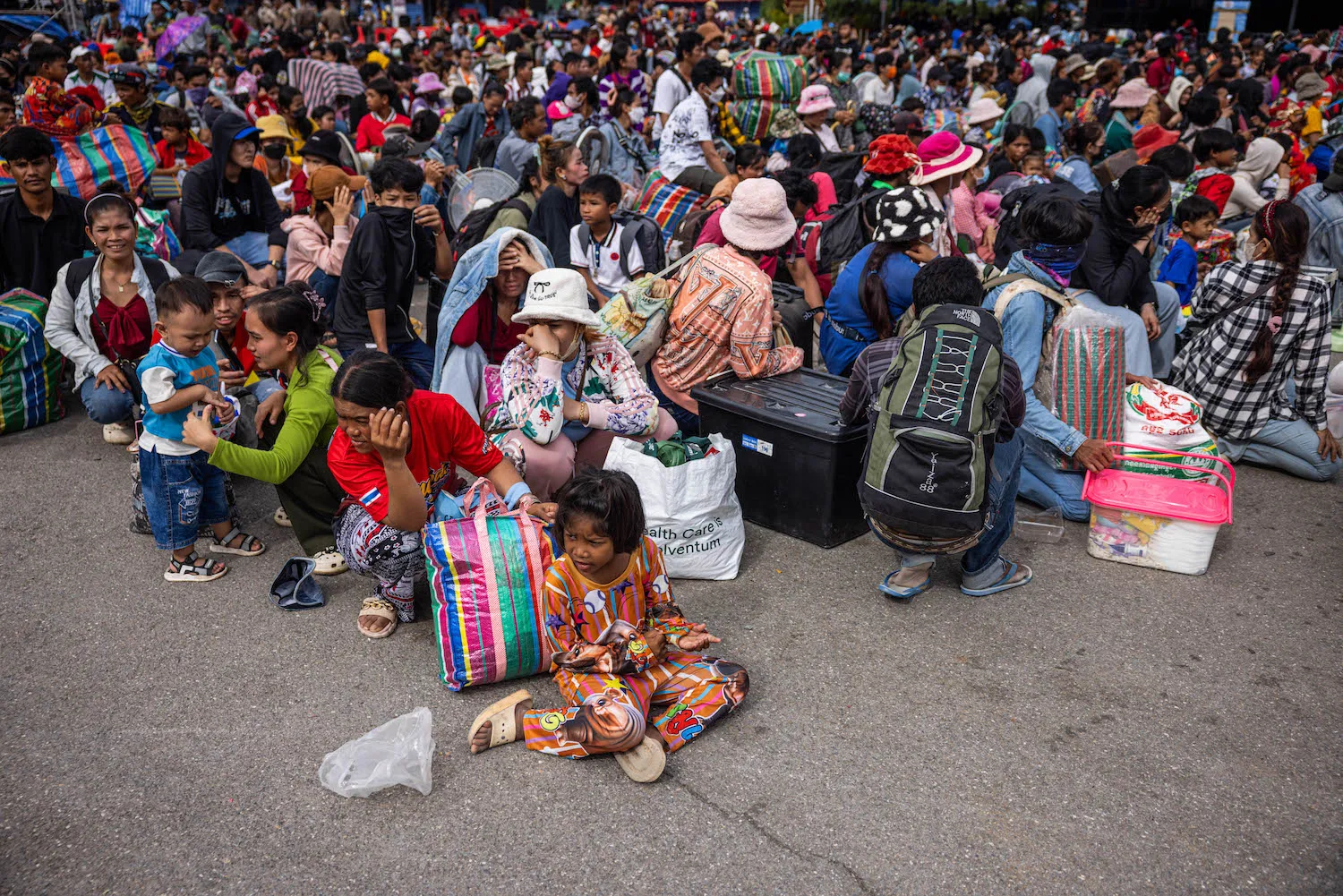 Cambodian migrant workers wait to cross the Ban Laem border checkpoint in Chanthaburi, Thailand, on July 29. Thailand and Cambodia agreed to a cease-fire in talks brokered by Malaysia after deadly clashes along their disputed border that have resulted in at least 35 deaths and displaced over 200,000 people. 
