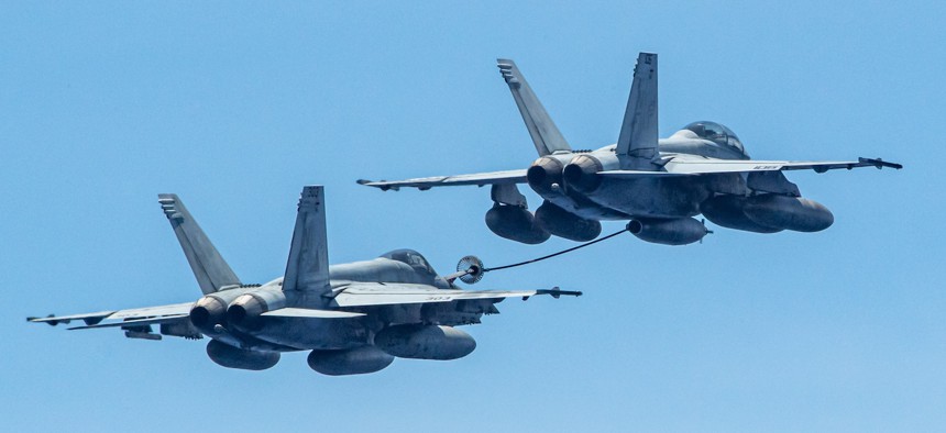 This isn’t going away anytime soon: one F/A-18F Super Hornet refuels another above the USS Ronald Reagan in the Pacific Ocean, July 3, 2024. 