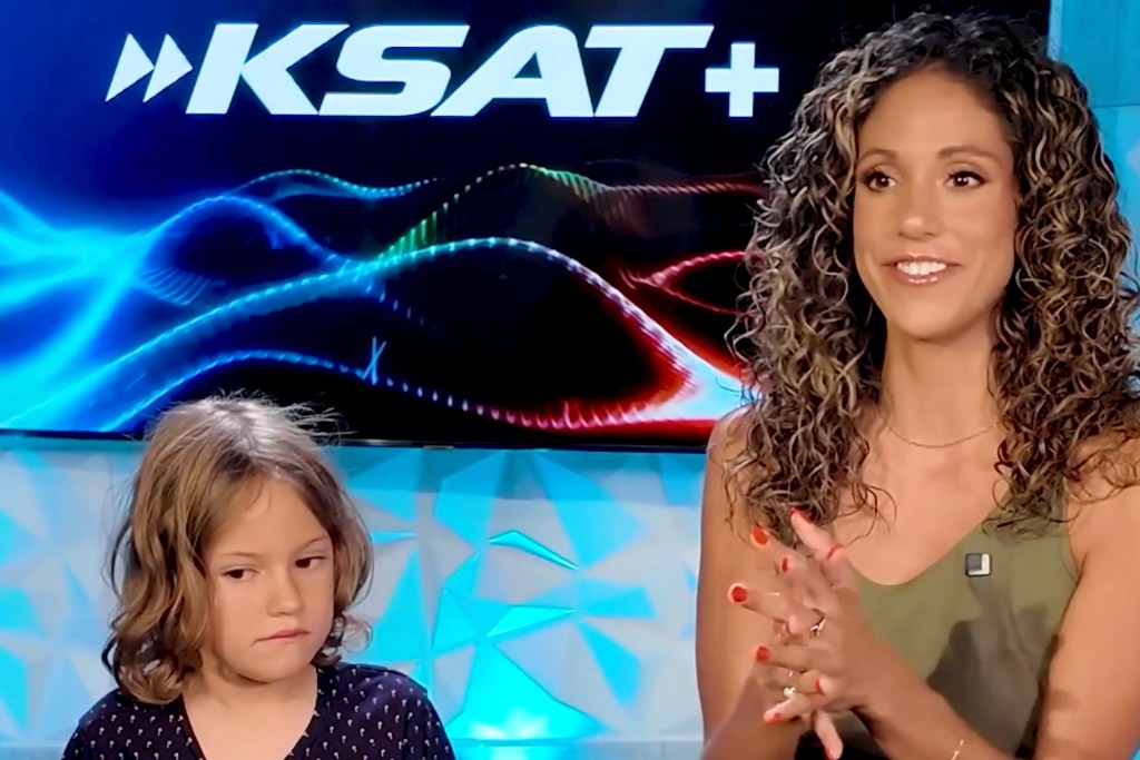 A woman and a young girl on a news segment discussing an octopus attack.