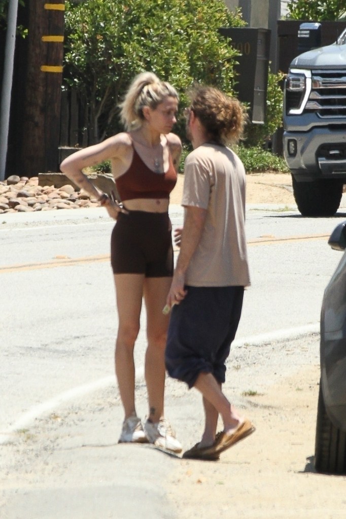 Justin Long comforting Paris Jackson while on a walk.
