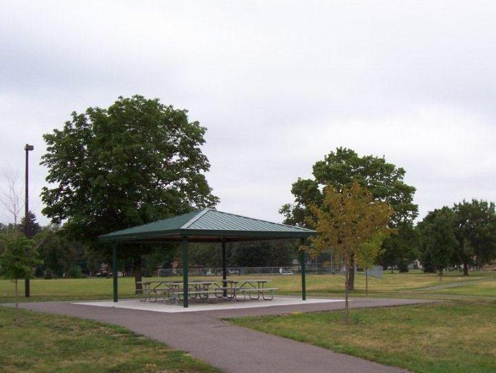 Park pavilion with picnic tables.