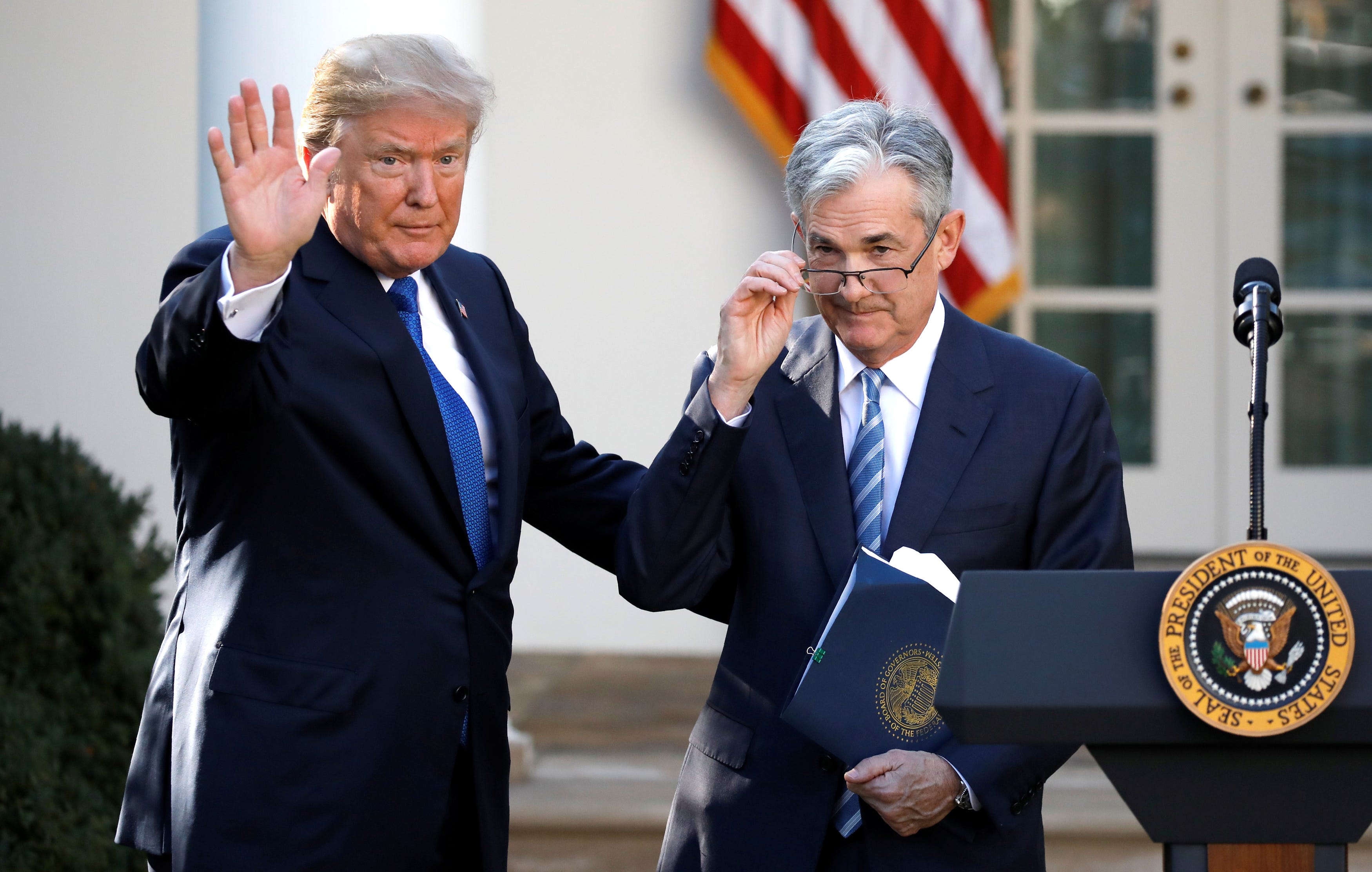 FILE PHOTO: U.S. President Donald Trump gestures with Jerome Powell, his nominee to become chairman of the U.S. Federal Reserve at the White House in Washington, U.S., November 2, 2017. REUTERS/Carlos Barria