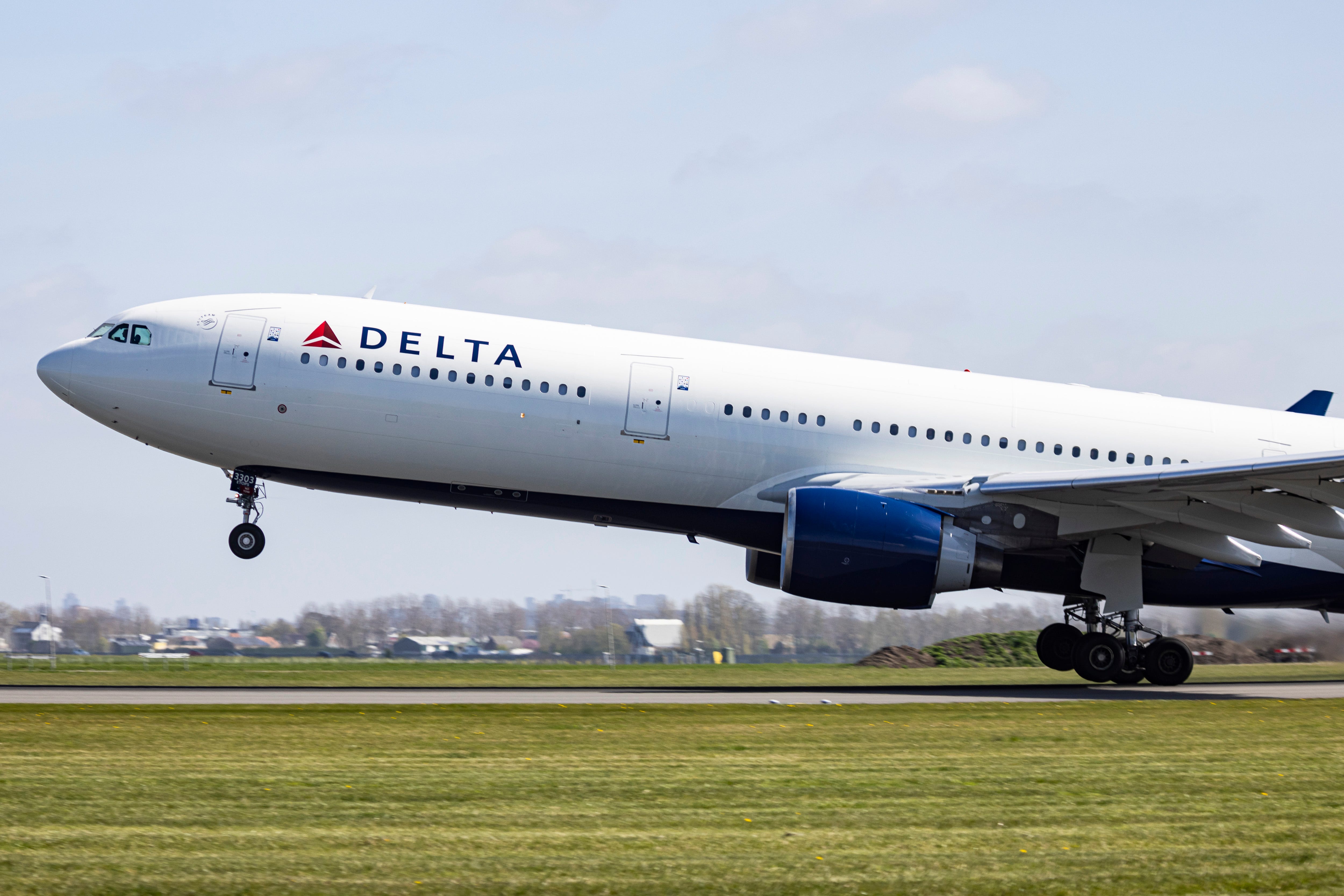 Delta Air Lines Airbus A330-300 wide body passenger airplane spotted taking off from Polderbaan runway departing from Amsterdam Schiphol AMS Airport