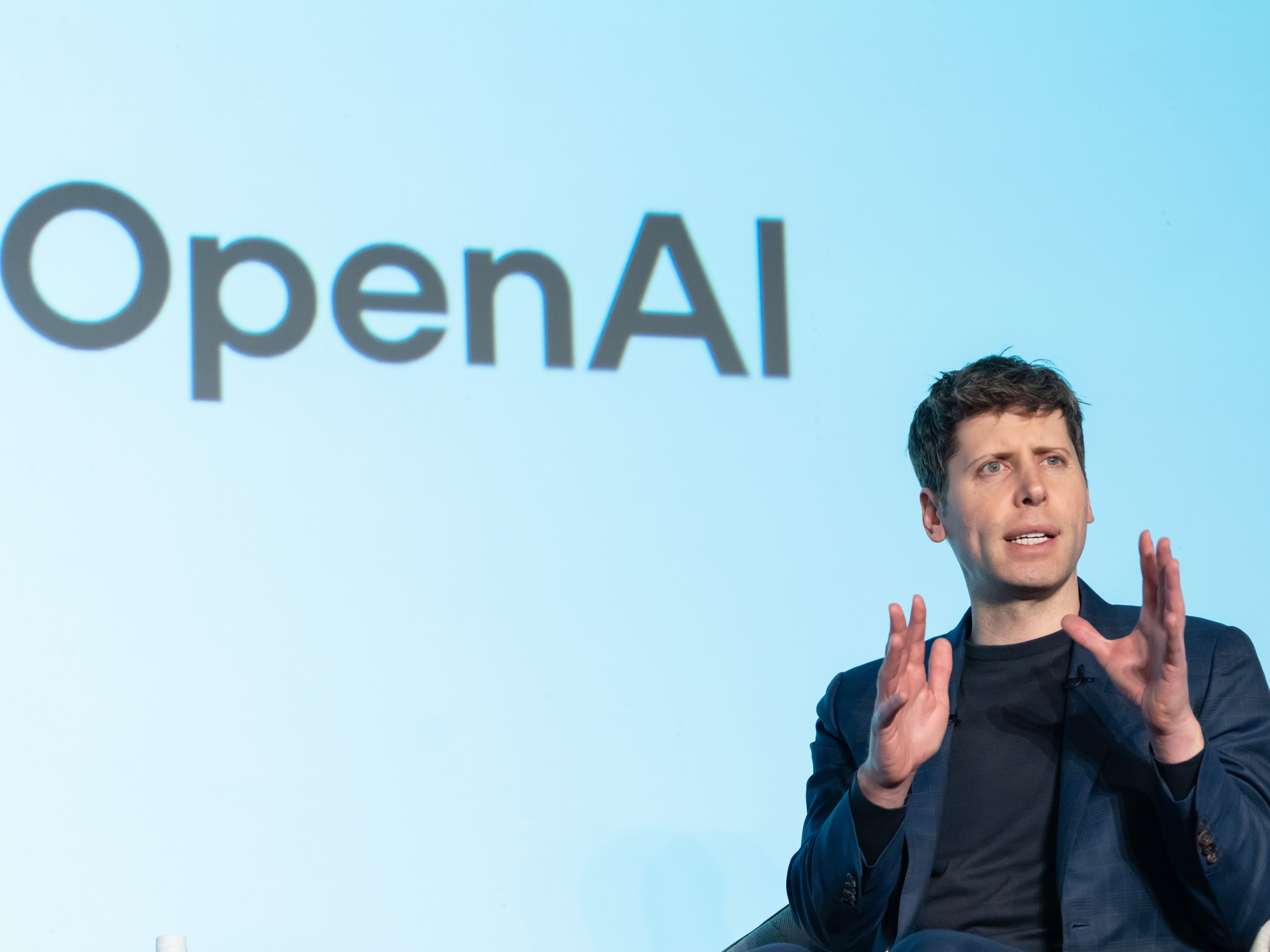 OpenAI CEO Sam Altman speaking at an event with SoftBank Group CEO Masayoshi Son in Tokyo, Japan.