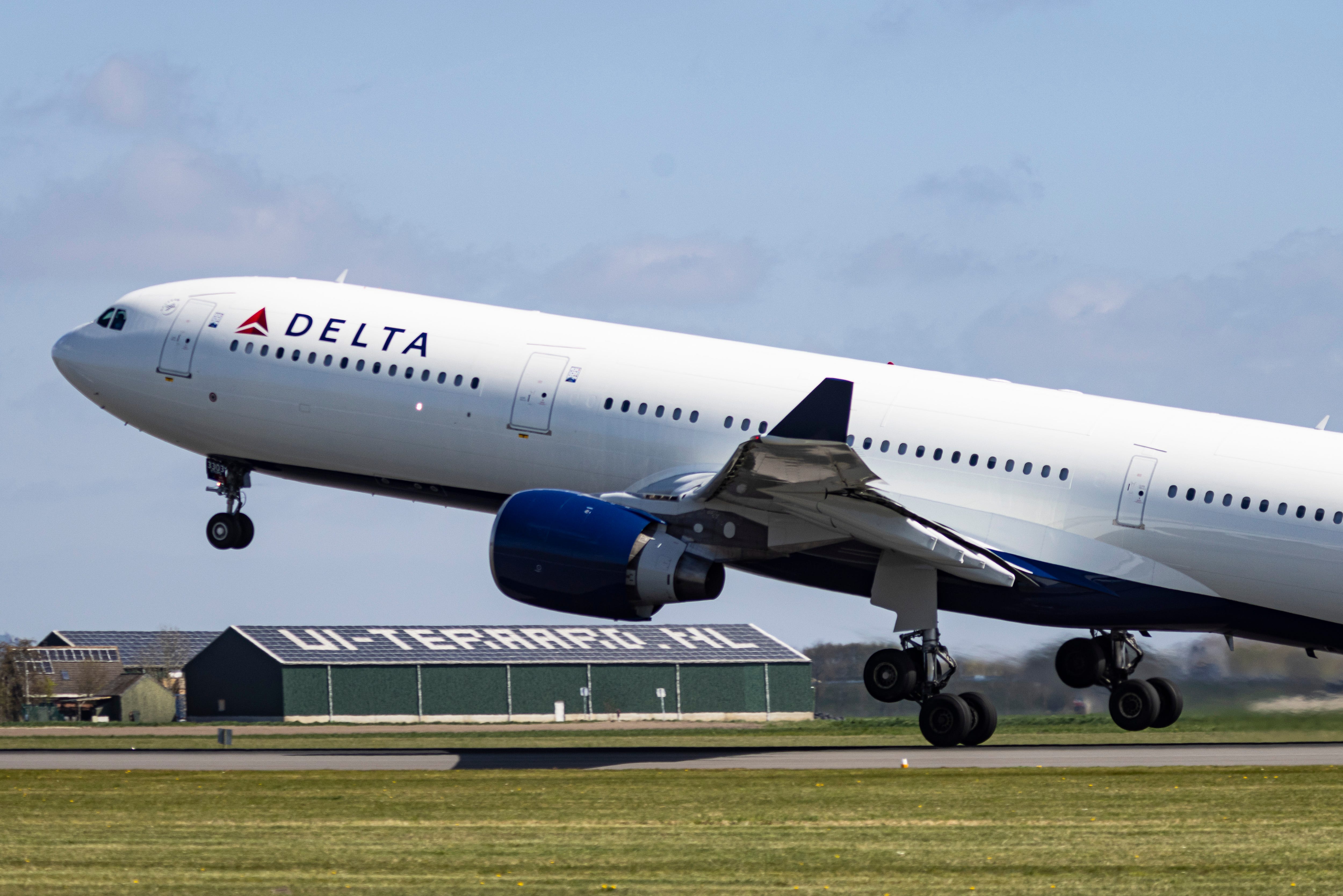 Delta Air Lines Airbus A330-300 wide body passenger airplane spotted taking off from Polderbaan runway departing from Amsterdam Schiphol AMS Airport to Minneapolis USA MSP airport as flight DL163.