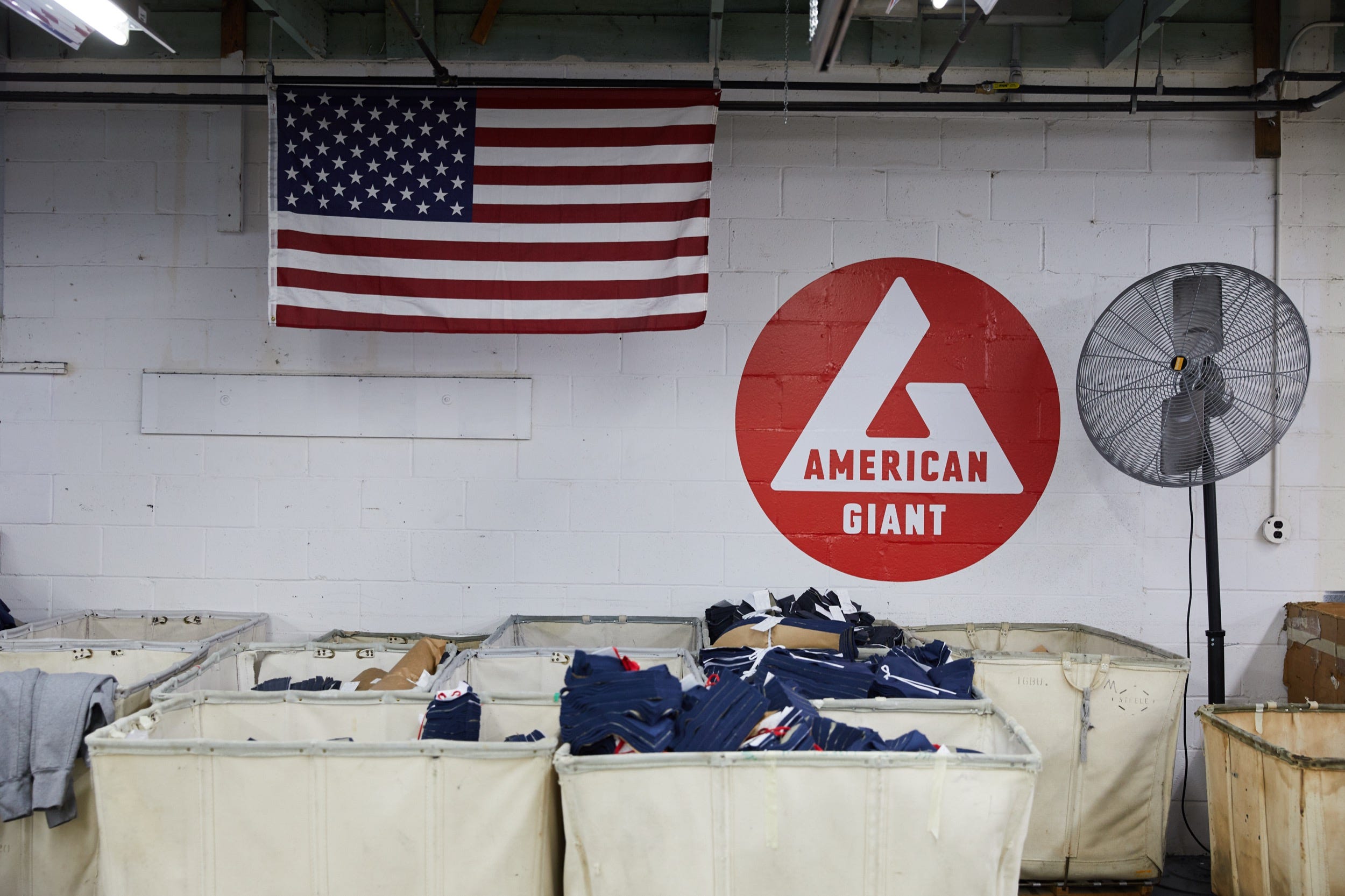 Bins of apparel at an American Giant facility.
