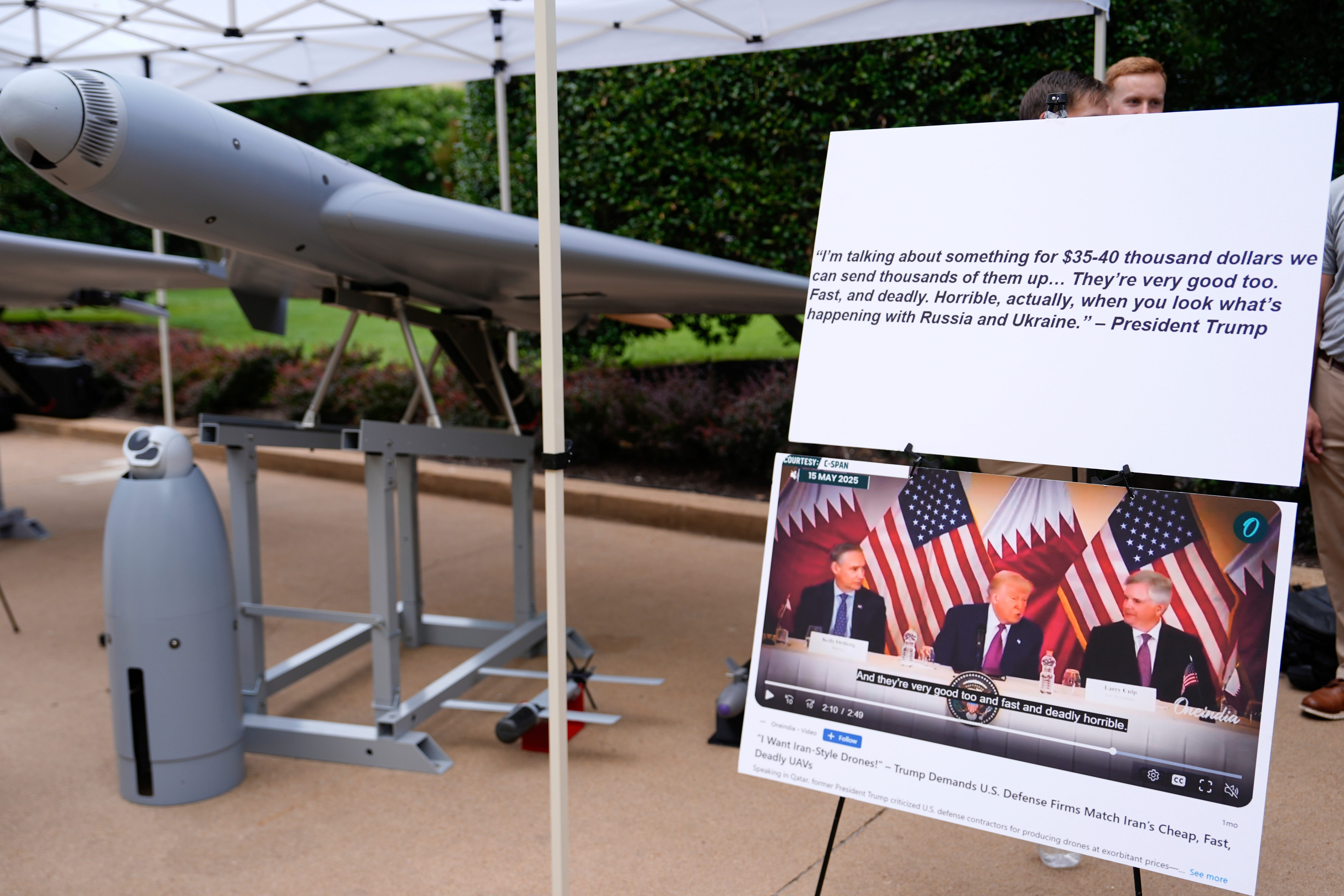A Shahed-style drone sitting beside a presentation of Trump quotes about cheap drones at the Pentagon.