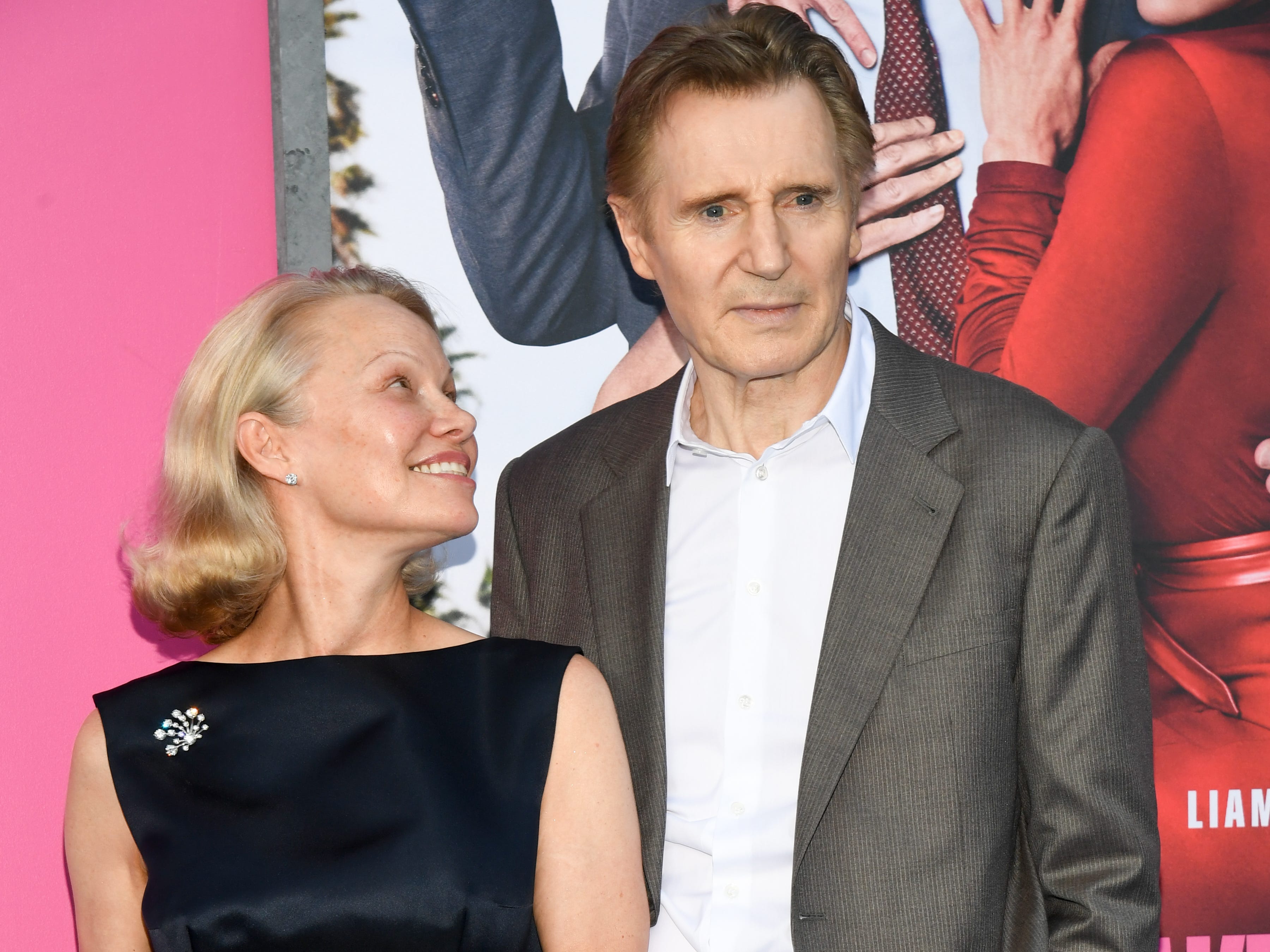 Pamela Anderson looking up to Liam Neeson