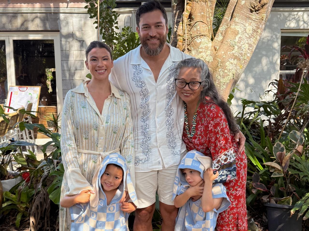 Family posing for photo with grandma