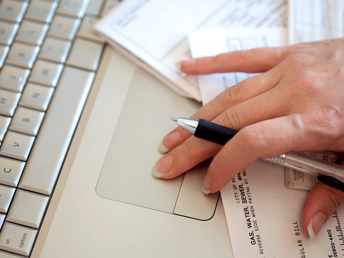 A woman using ChatGPT to budget.