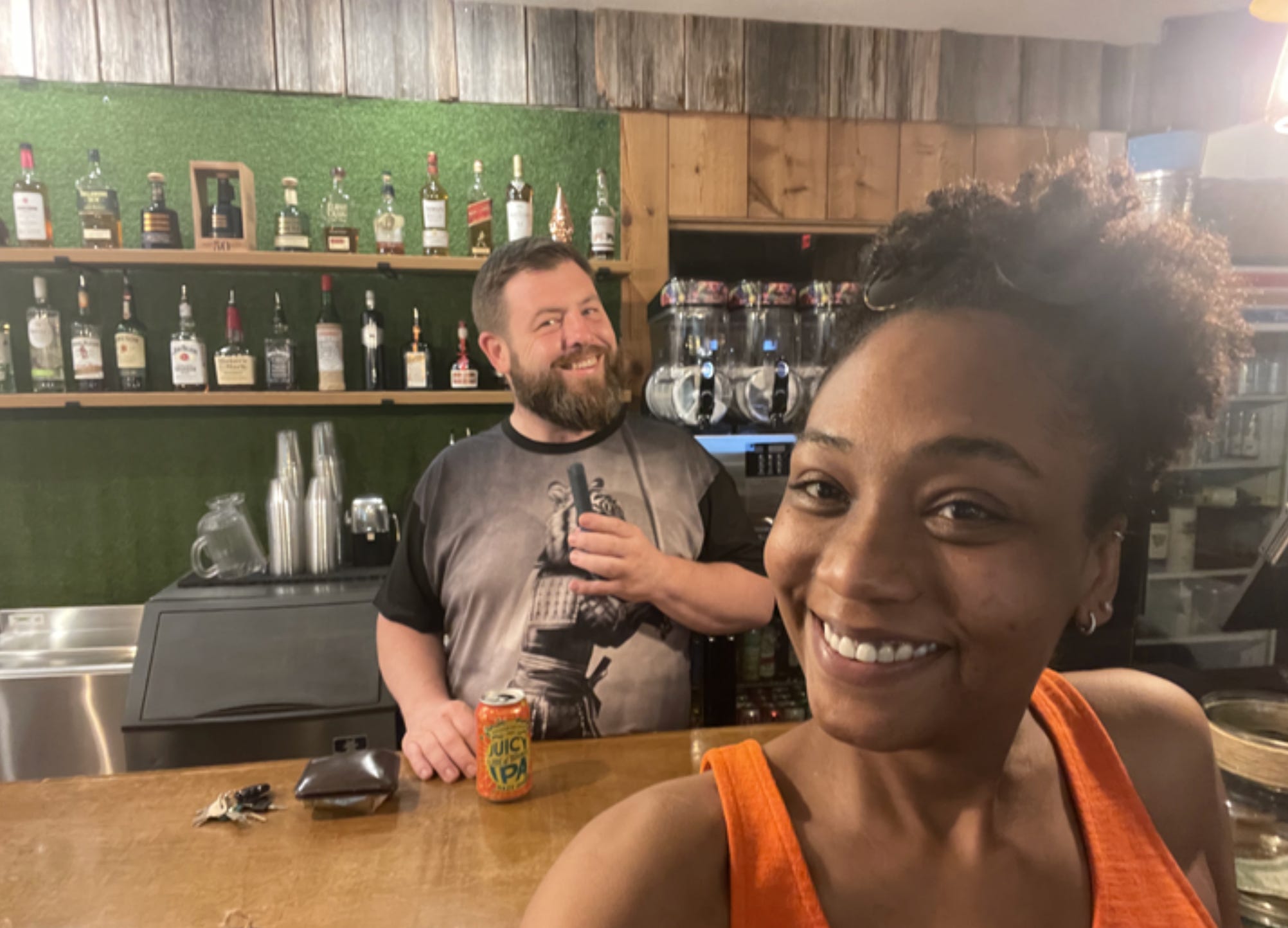 The writer and her husband at the bar of their restaurant.