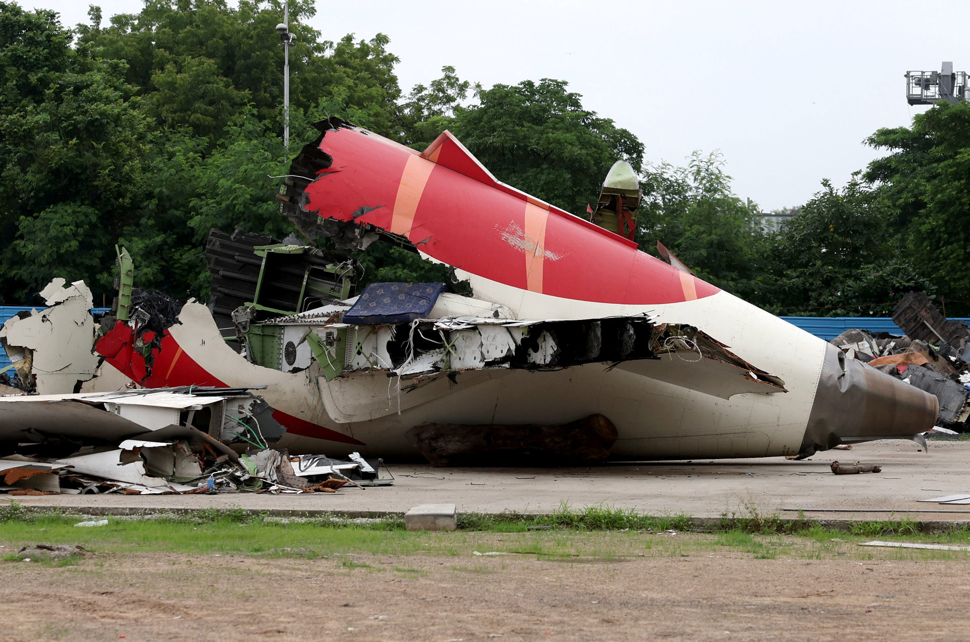 Wreckage of the Air India Boeing 787-8 Dreamliner plane sits on the open ground, outside Sardar Vallabhbhai Patel International Airport, where it took off and crashed nearby shortly afterwards, in Ahmedabad, India July 12, 2025