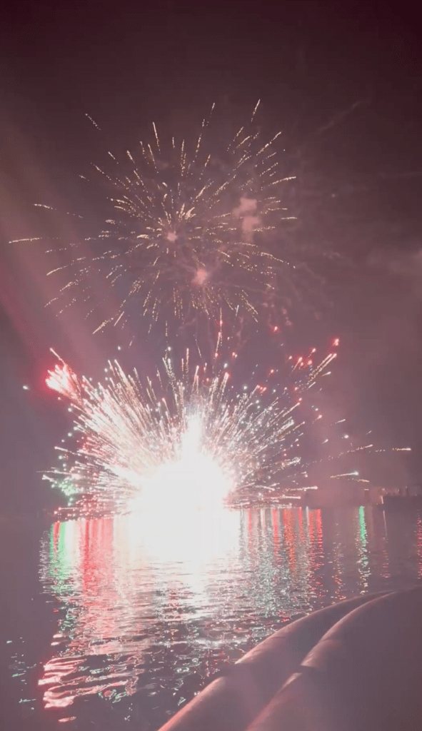 Fireworks shoot out of a boat on Lake Martin in Alabama on July 4, 2025.