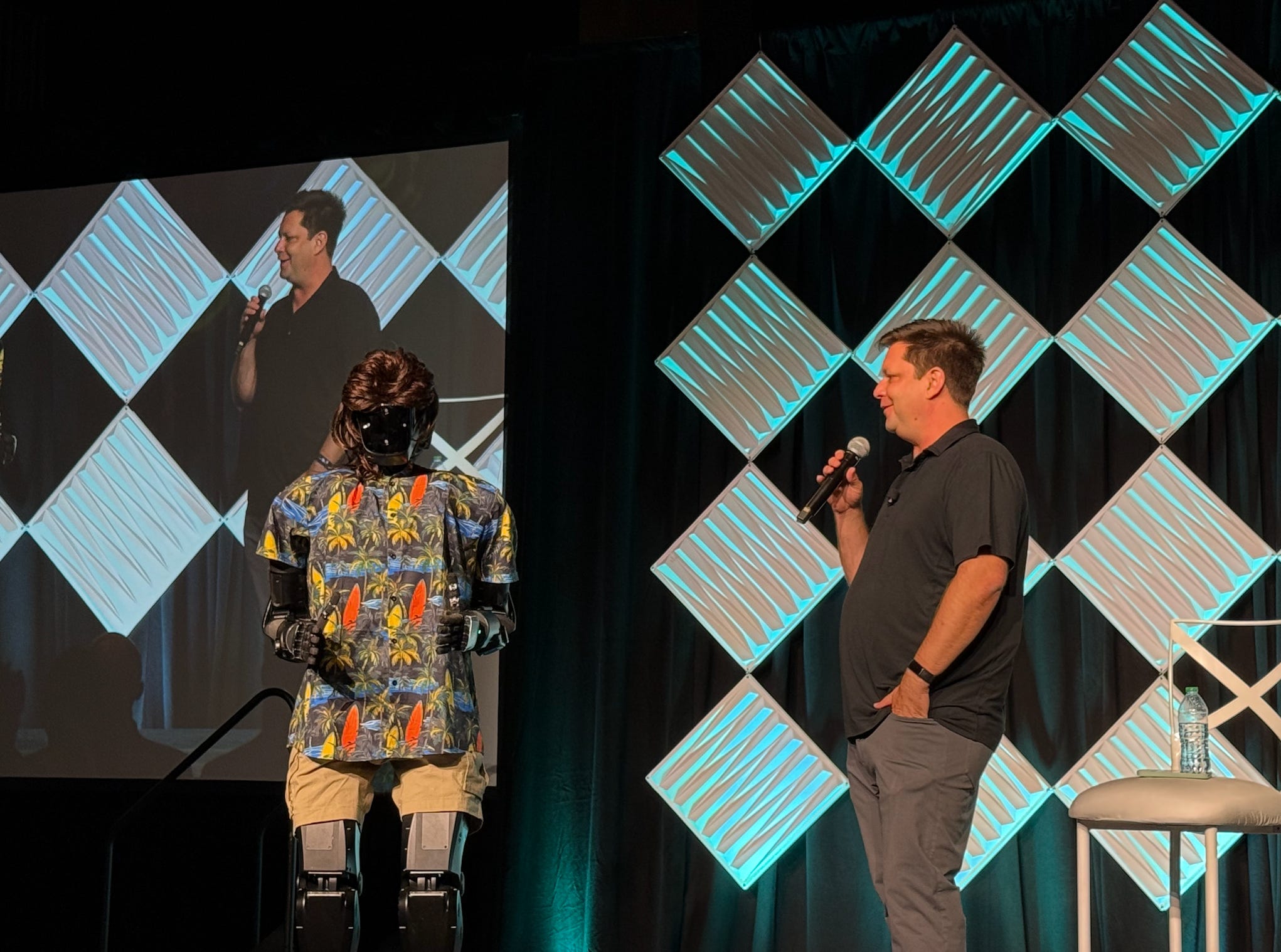 Ashlee Vance and Palmer Luckey, represented by a humanoid robot in a Hawaiian shirt