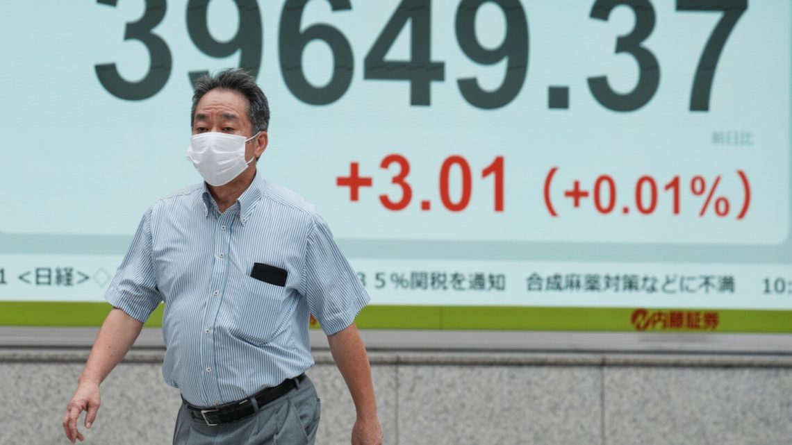 Asian shares are mixed after Wall Street closes higher and edges to more records