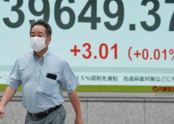 Asian shares are mixed after Wall Street closes higher and edges to more records