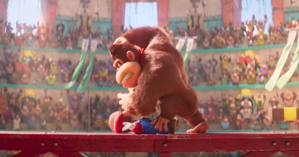 Donkey Kong in the Super Mario movie pummels the plumber with his fists. 
