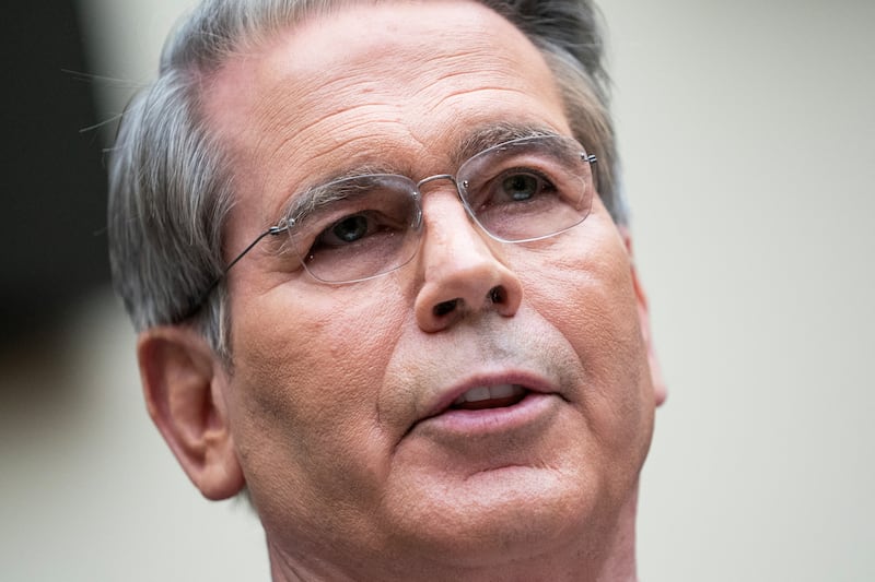 Close-up of Treasury Secretary Scott Bessent testifies appearing at a House committee hearing.