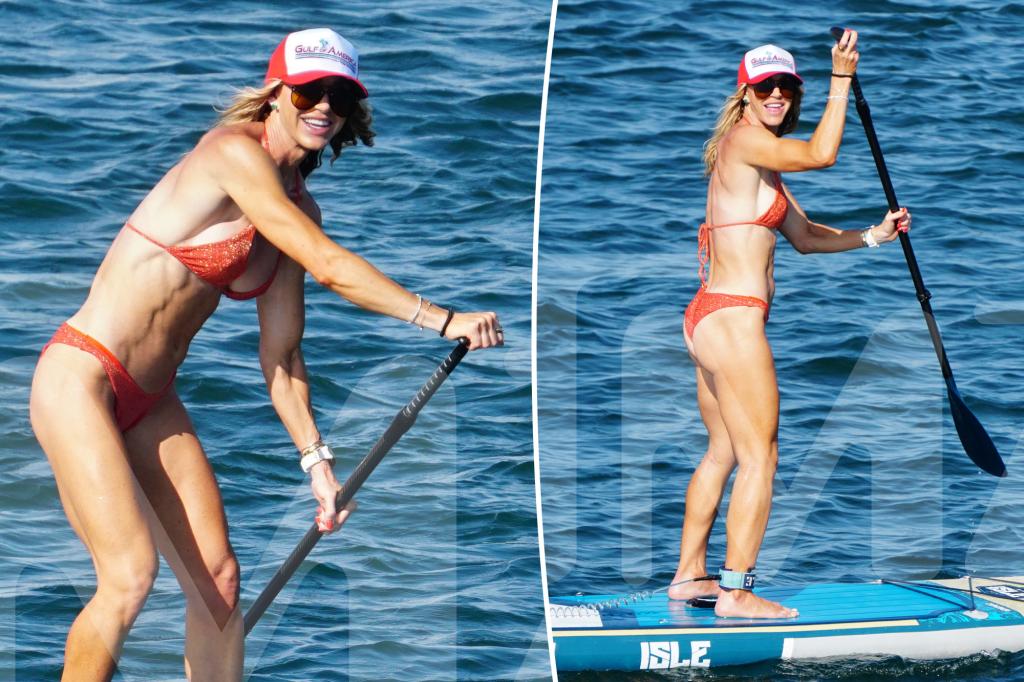 Bikini-clad Lara Trump shows off her toned body while paddleboarding with husband Eric