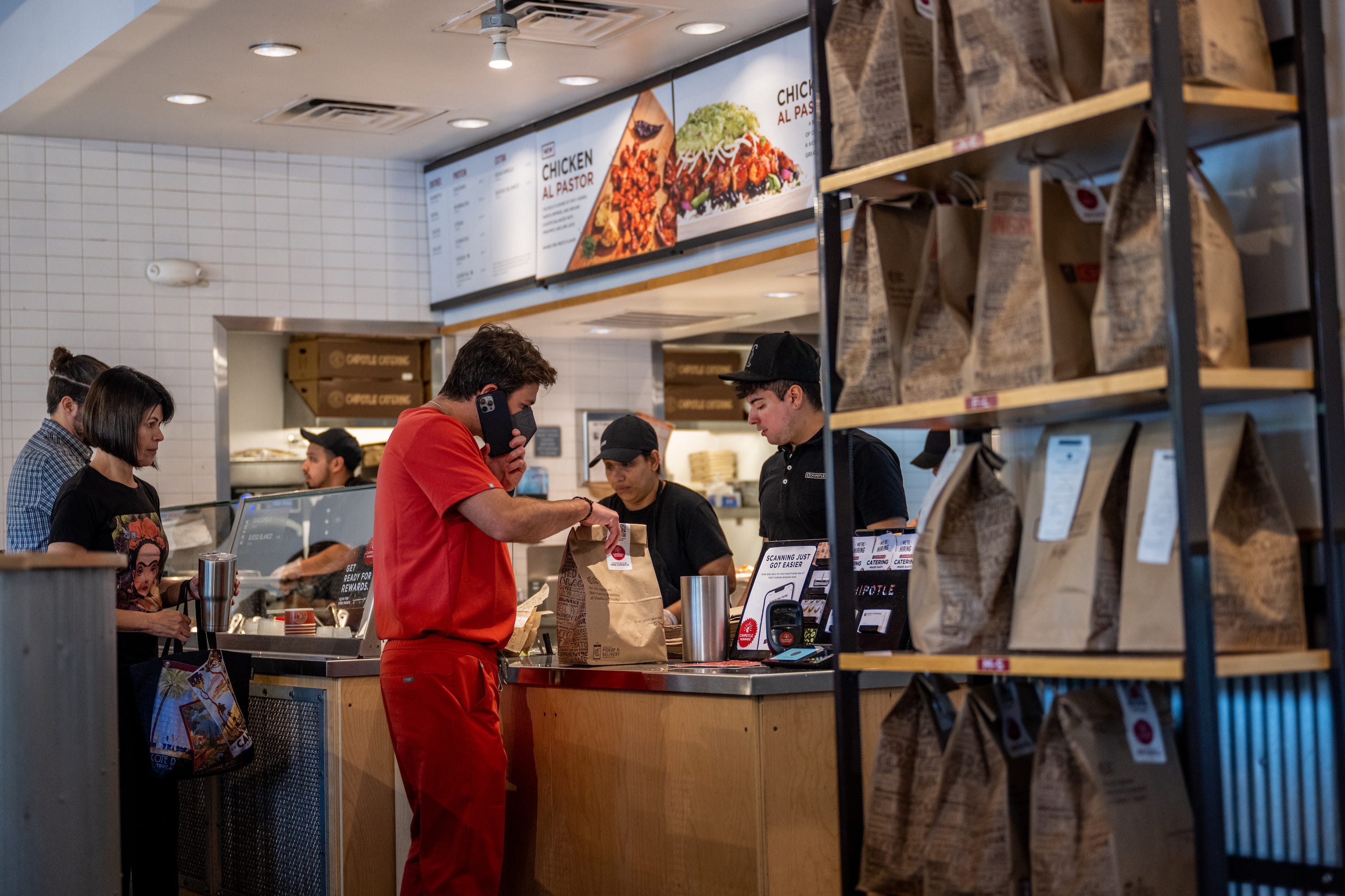 Customers order food at a Chipotle Mexican Grill restaurant on April 26, 2023 in Austin, Texas.