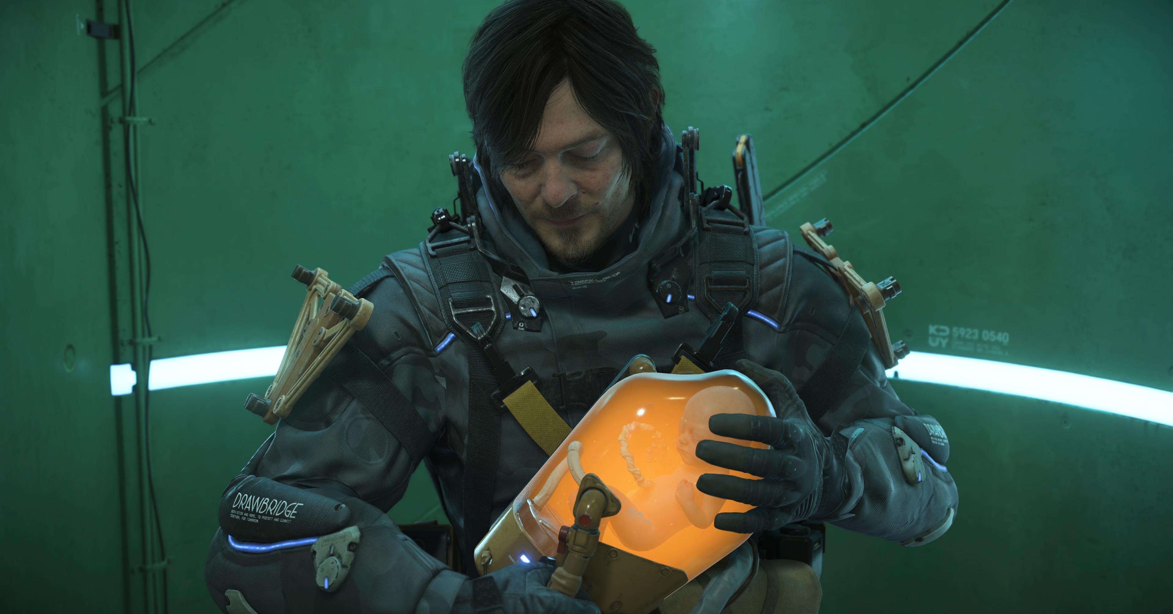 Sam in Death Stranding 2, holding a BB pod with the spirit of Lou inside