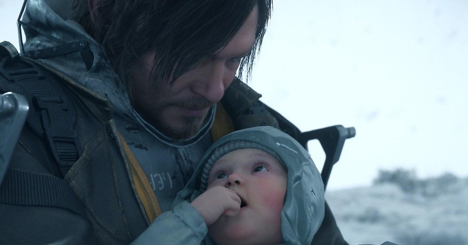 Norman Reedus holding a cute baby in Death Stranding 2