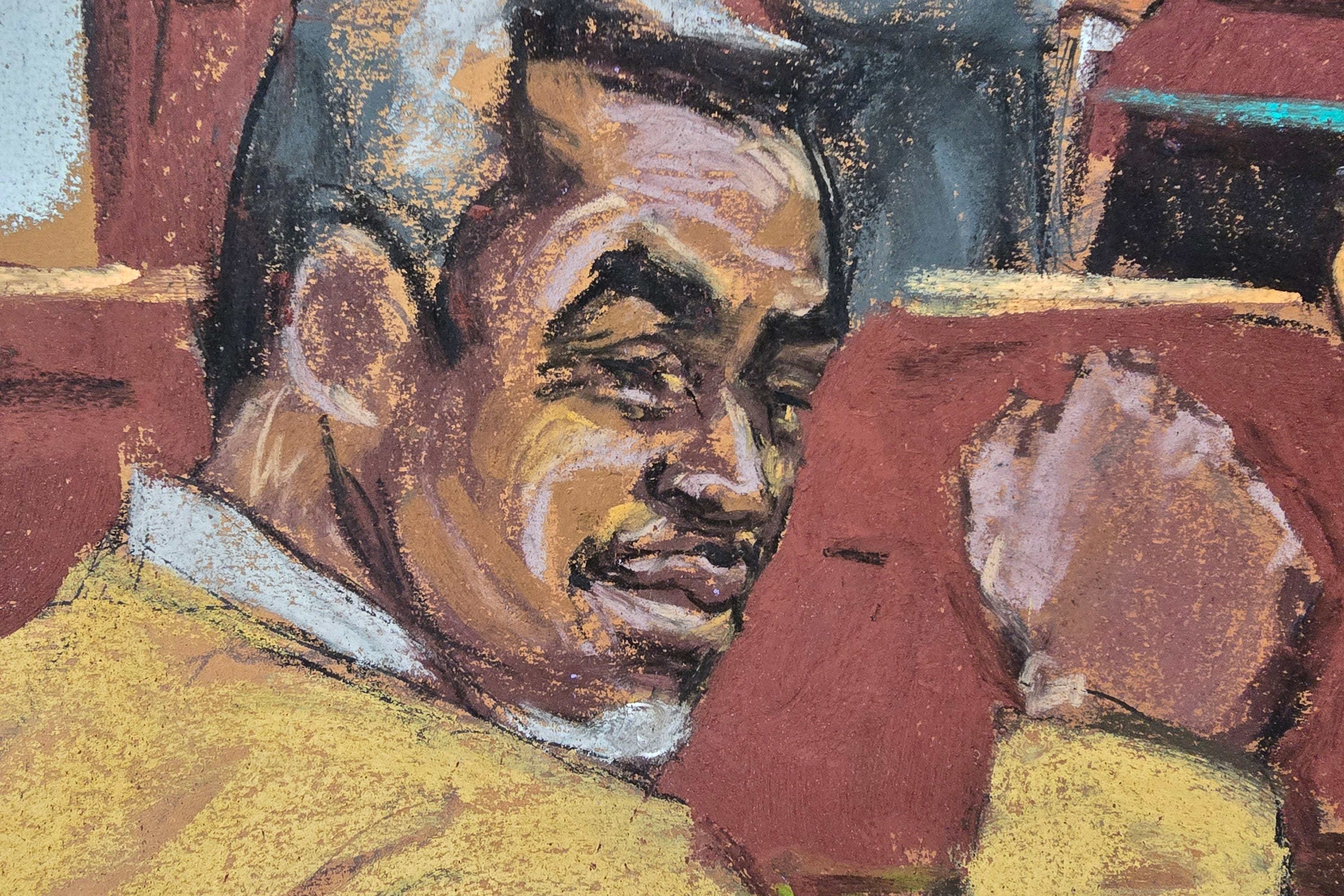 In this courtroom sketch, Sean "Diddy" Combs smiles and raises his fist in reaction to being found not guilty of racketeering and sex-trafficking charges in federal court in Manhattan.