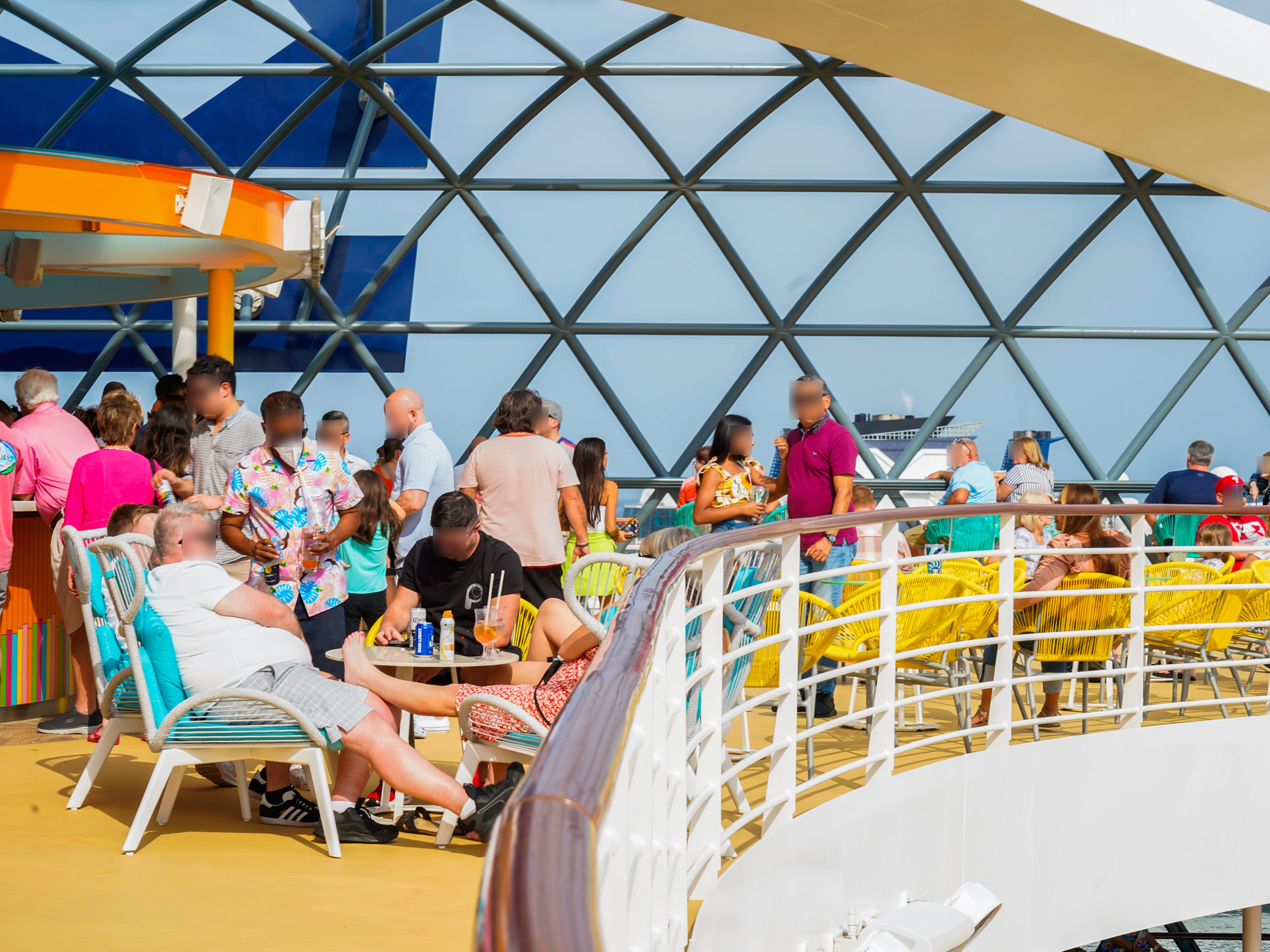 A crowd of cruisers on the top deck of a ship