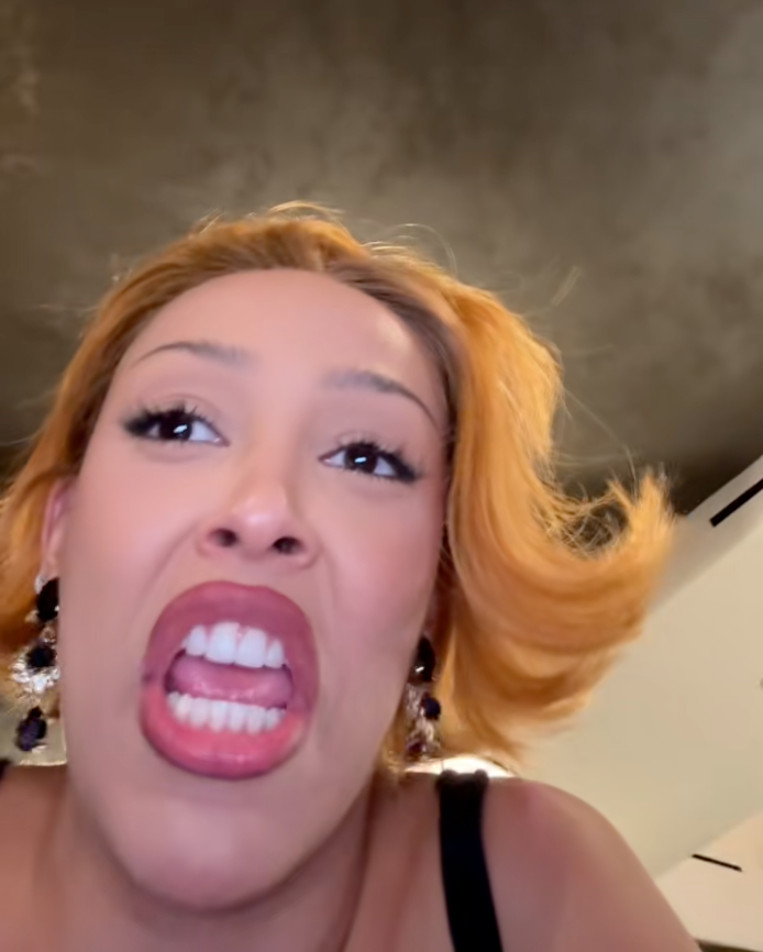 Doja Cat mocking Sydney Sweeney's American Eagle Outfitters jeans ad on TikTok.