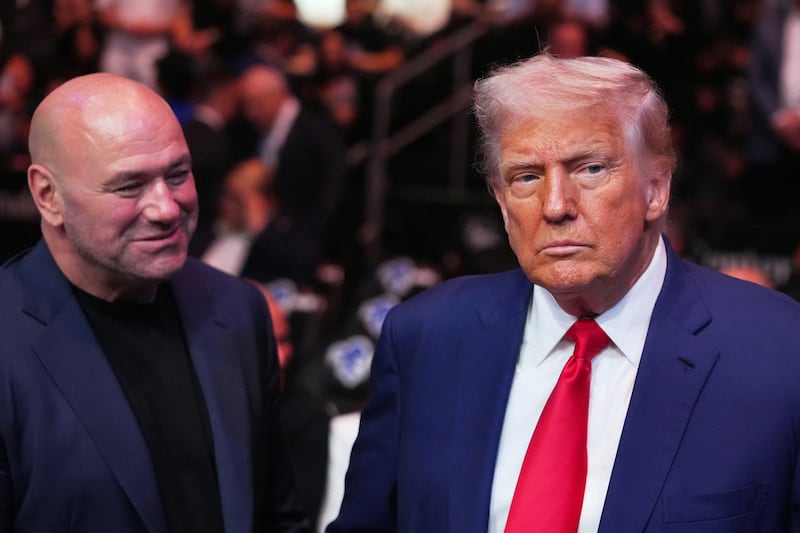 U.S. President Donald Trump attends the UFC-316 mixed martial arts event, at the Prudential Center, Saturday, June 7, 2025, in Newark, N.J., as UFC’s Dana White, looks on.   Frank Franklin II/Pool via REUTERS