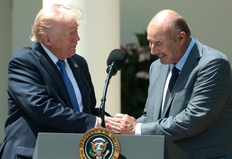 WASHINGTON, DC - MAY 01: U.S. President Donald Trump (L) shakes hands with Dr. Phil McGraw as he delivers remarks during a National Day of Prayer event in the Rose Garden at the White House on May 1, 2025 in Washington, DC. The National Day of Prayer is a congressionally recognized observance that calls on people of all faiths to participate in a day of prayer and reflection. (Photo by Alex Wong/Getty Images)