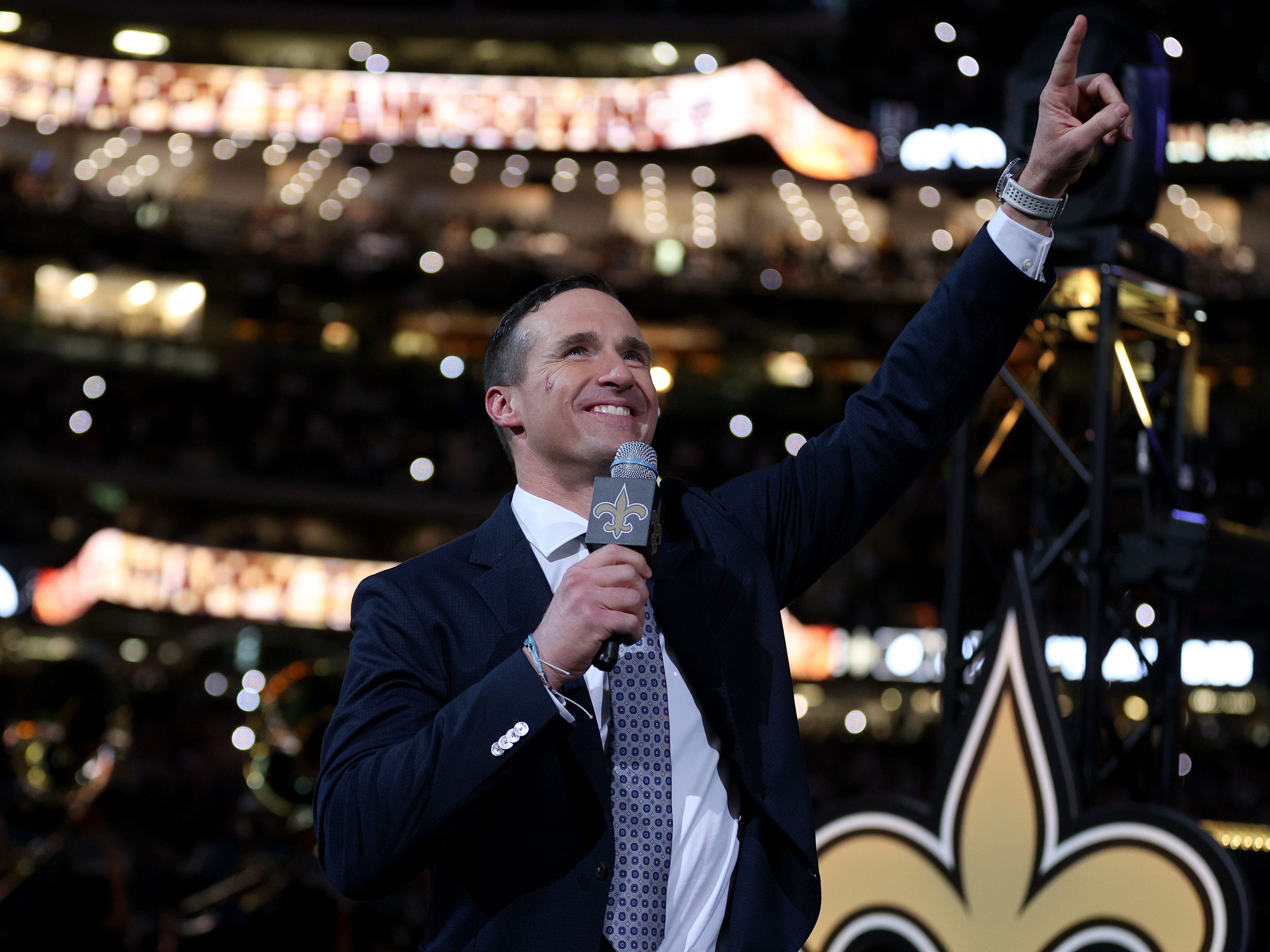 Drew Brees speaks to the crowd during halftime of a game between the New Orleans Saints and the Buffalo Bills in 2021.