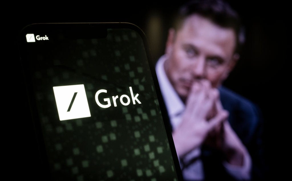 The xAI and Grok logos are seen in this illustration photo taken on November 5, 2023 in Warsaw, Poland. Elon Musk's xAI company this week introduced Grok, its conversational AI, which it says can match GPT-3.5 in performance.