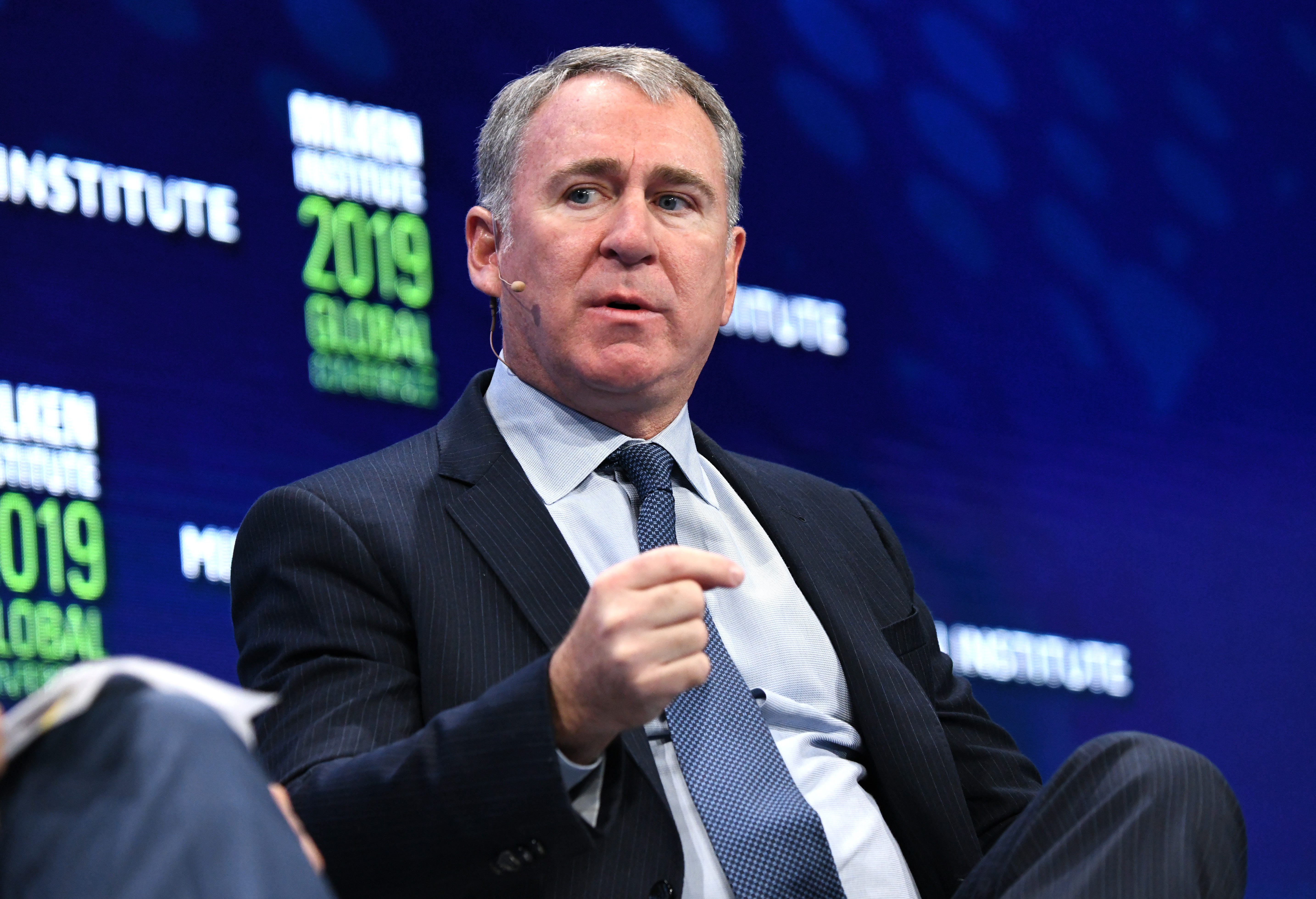 Ken Griffin speaking on a stage