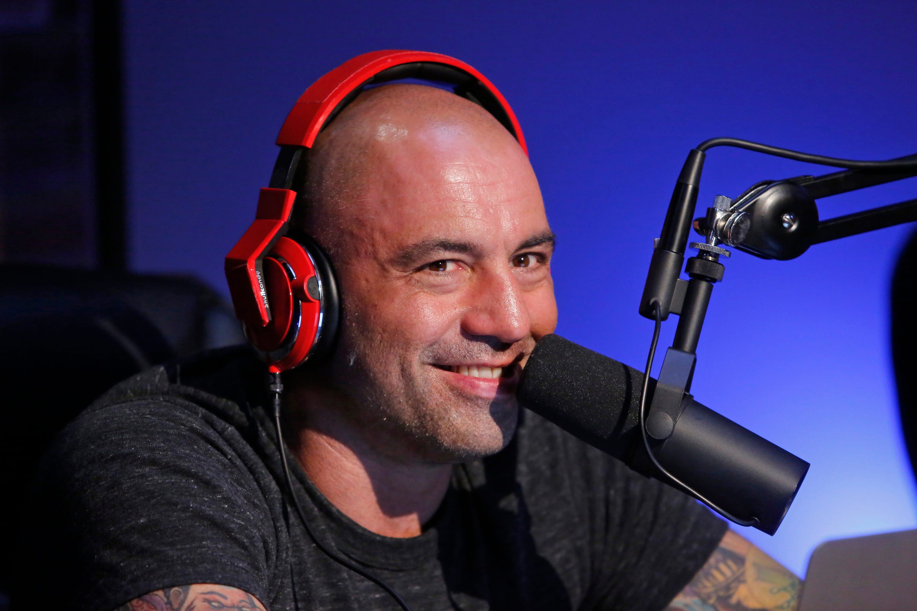 Joe Rogan speaking into a mic.